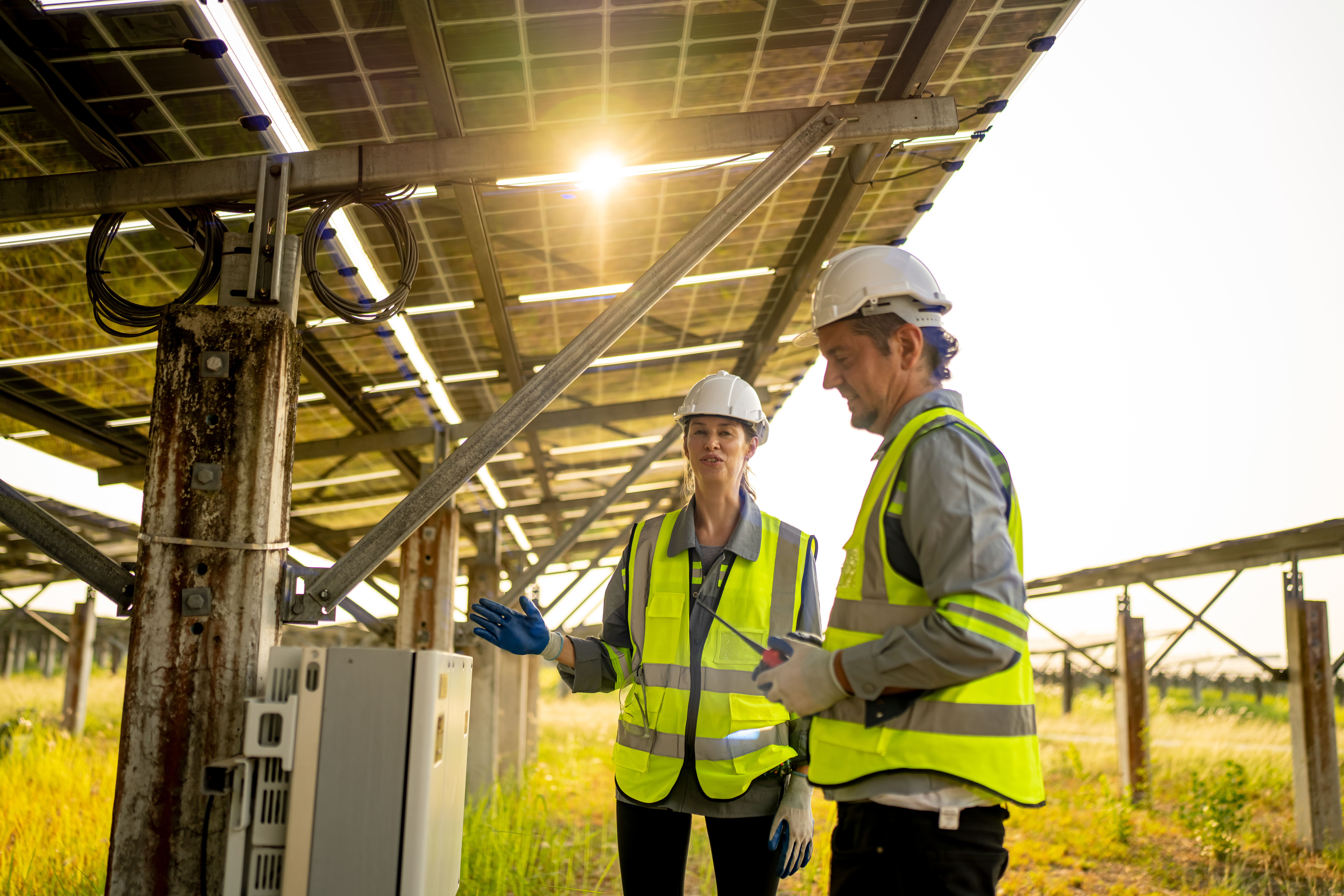 Engineer hand is installing and checking an operation of sun and cleanliness of photovoltaic solar panels, Engineer with energy measurement tool photovoltaic modules for renewable energy